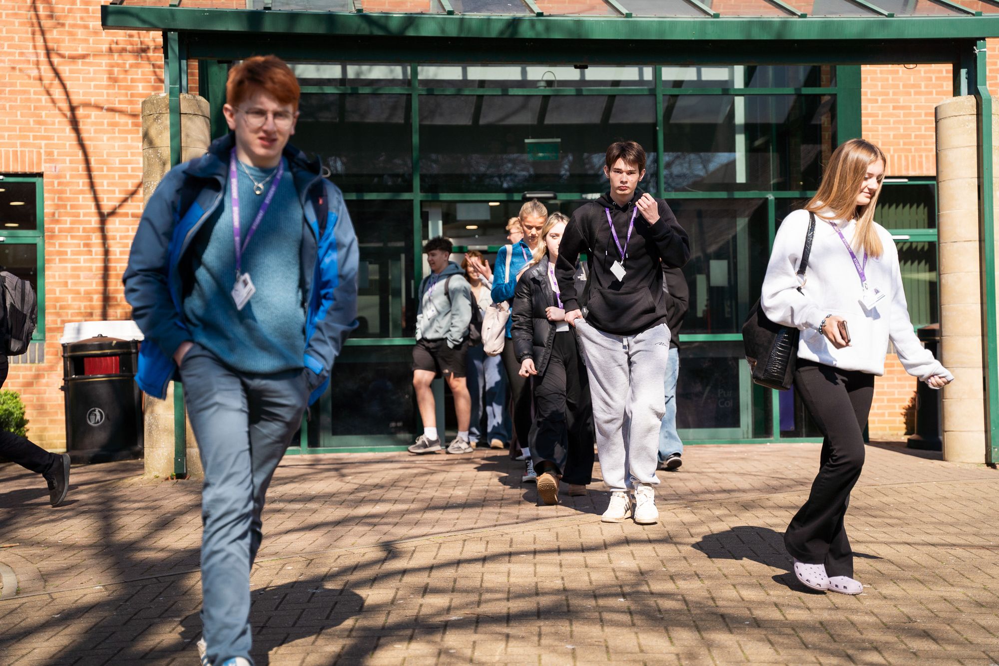 Students leaving the building through the main entrance