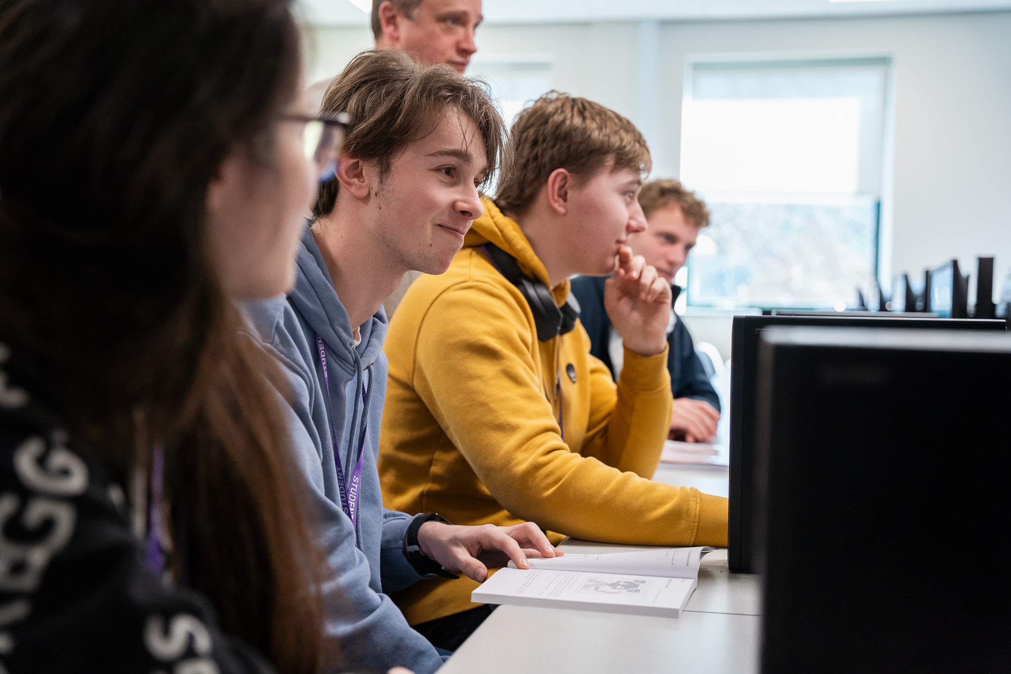 Students working at computers in a classroom