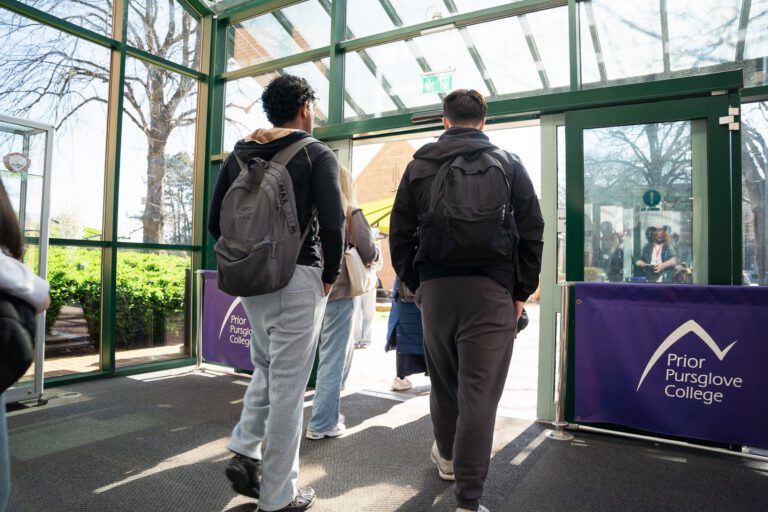 Students entering the college past a Prior Pursglove College banner