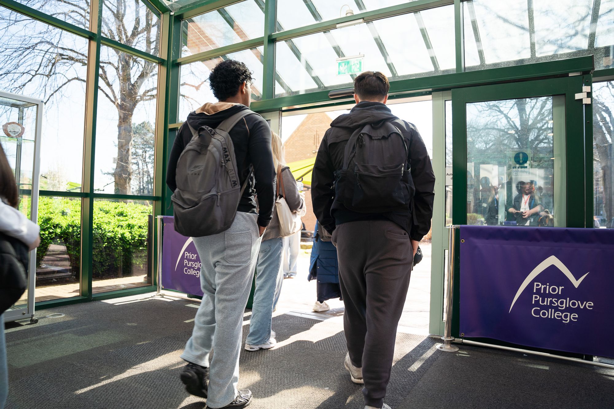 Students entering the college past a Prior Pursglove College banner