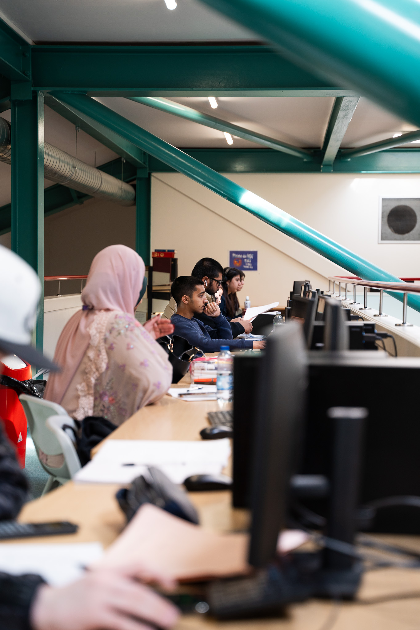 Students working at computers in an IT suite