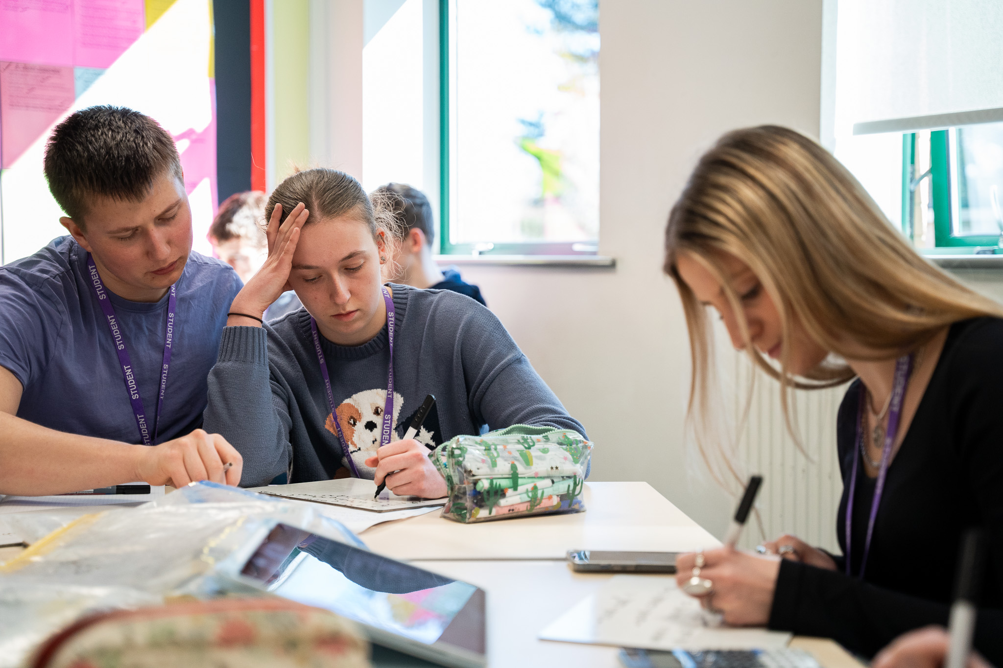 A tutor helping a student with their work