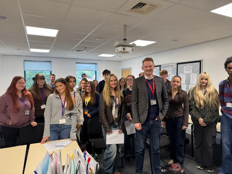 Luke Myer MP standing with Politics students in a classroom at Prior Pursglove College