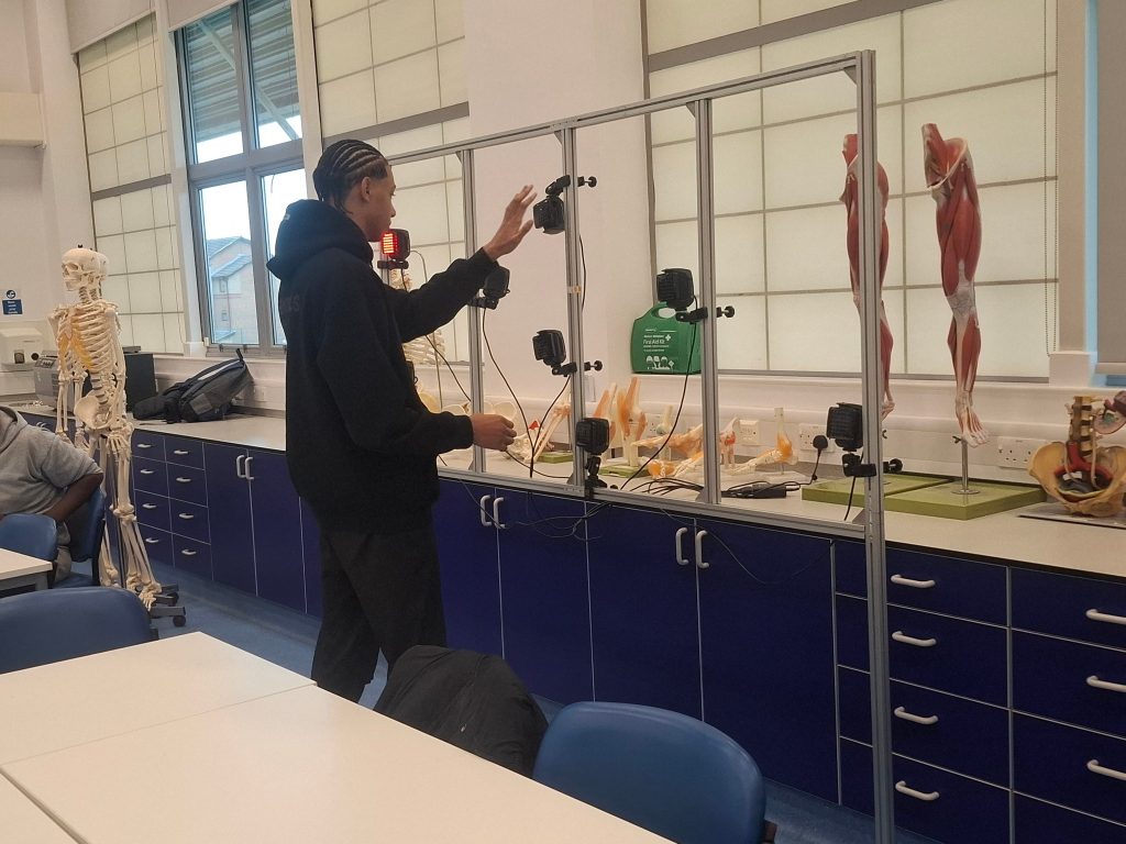 A student looks at anatomy models in a Teesside University lab