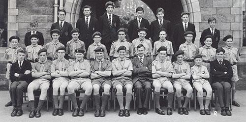 The scout group in 1963 with scoutmaster Mr Noble and Mr Stairmand, scouts in uniform and older boys in blazers in three rows.